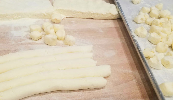 Now begin to cut uniform pieces of gnocchi.