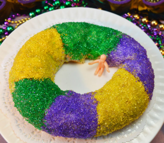 A fully decorated King cake. 