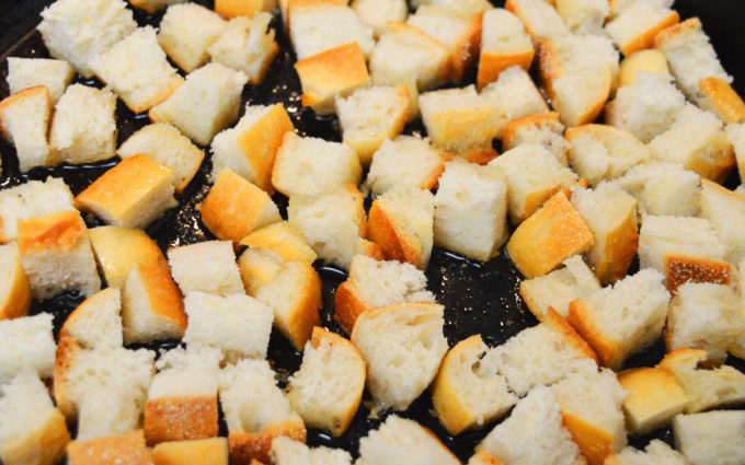 Do not over crowd the pan. You'll need room to move and turn the bread cubes as they cook. 