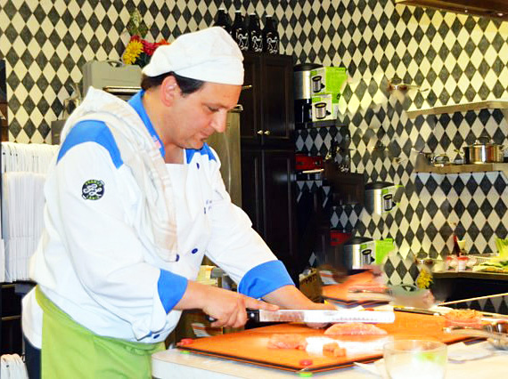 A salmon cooking demonstration. 