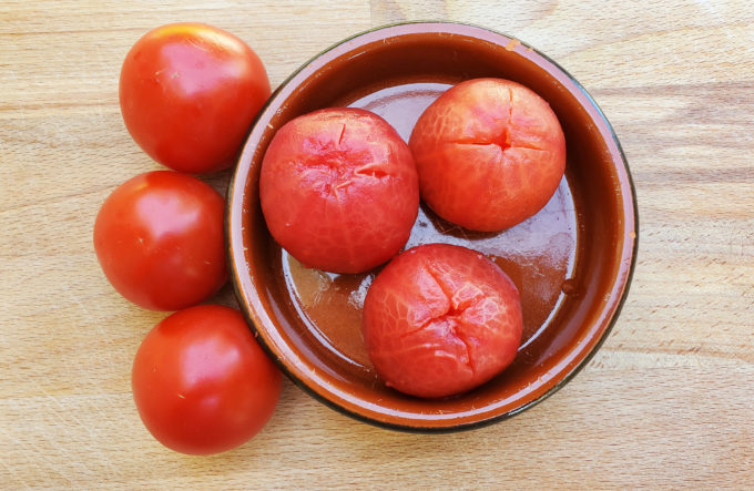 The tomatoes in the dish have been blanched and their skins removed.